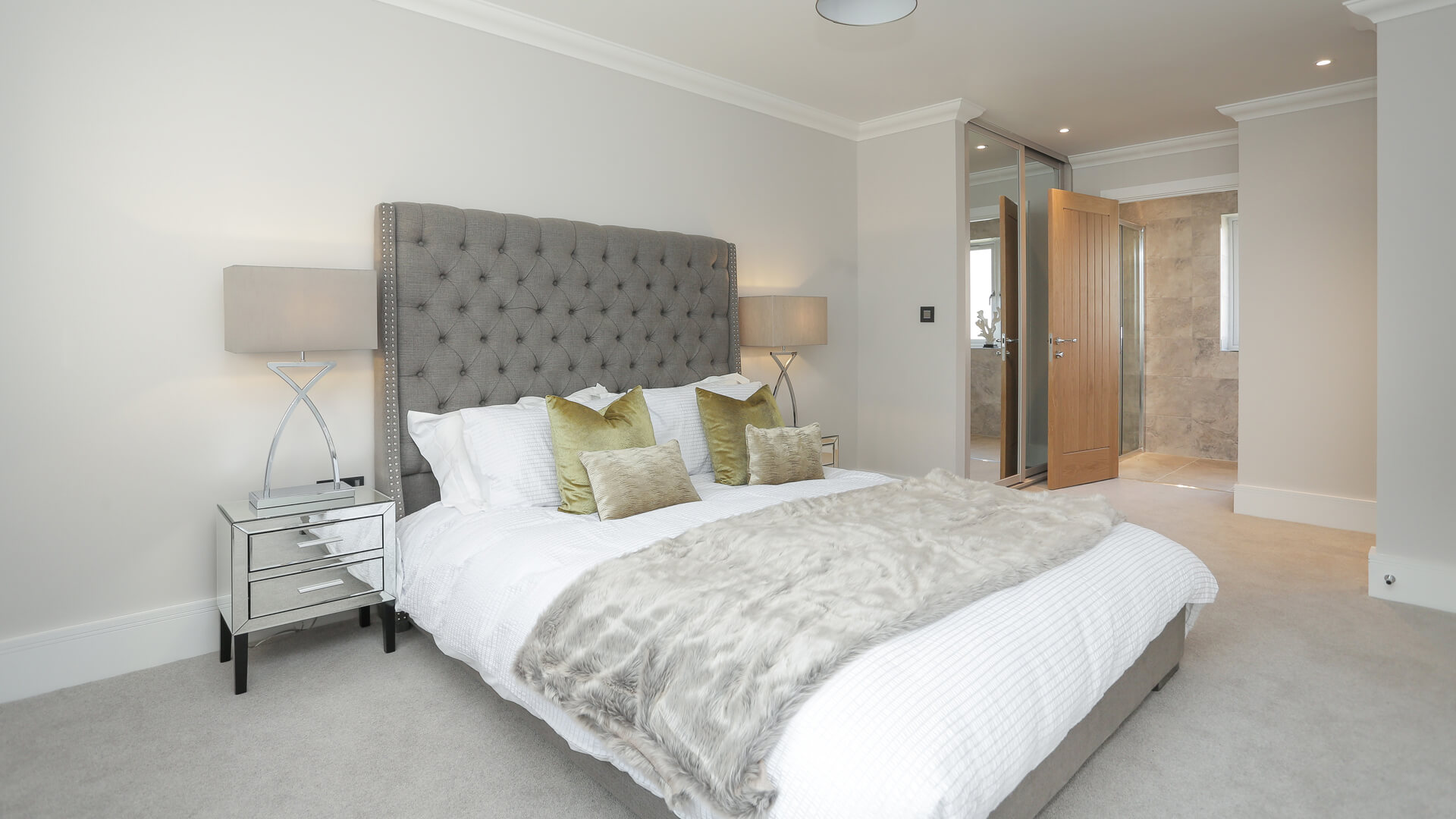 Dressed double bed in master bedroom at Woodside court.