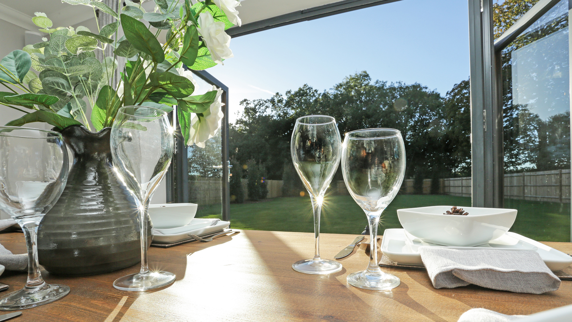 View of the garden through bifold from the dining area in plot 14 weavers park