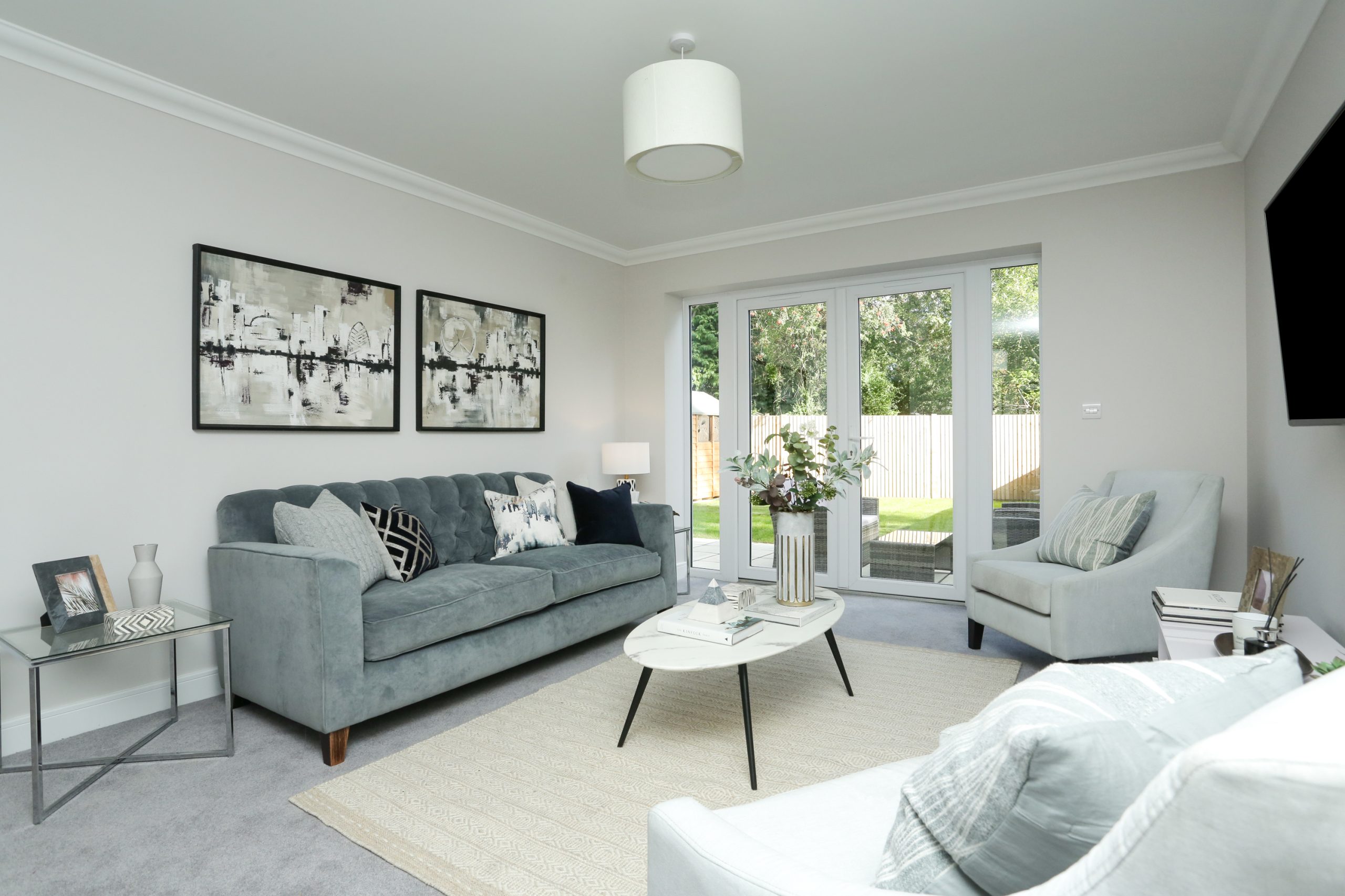 Living room with French doors out to the garden at Mulberry Place Phase 2