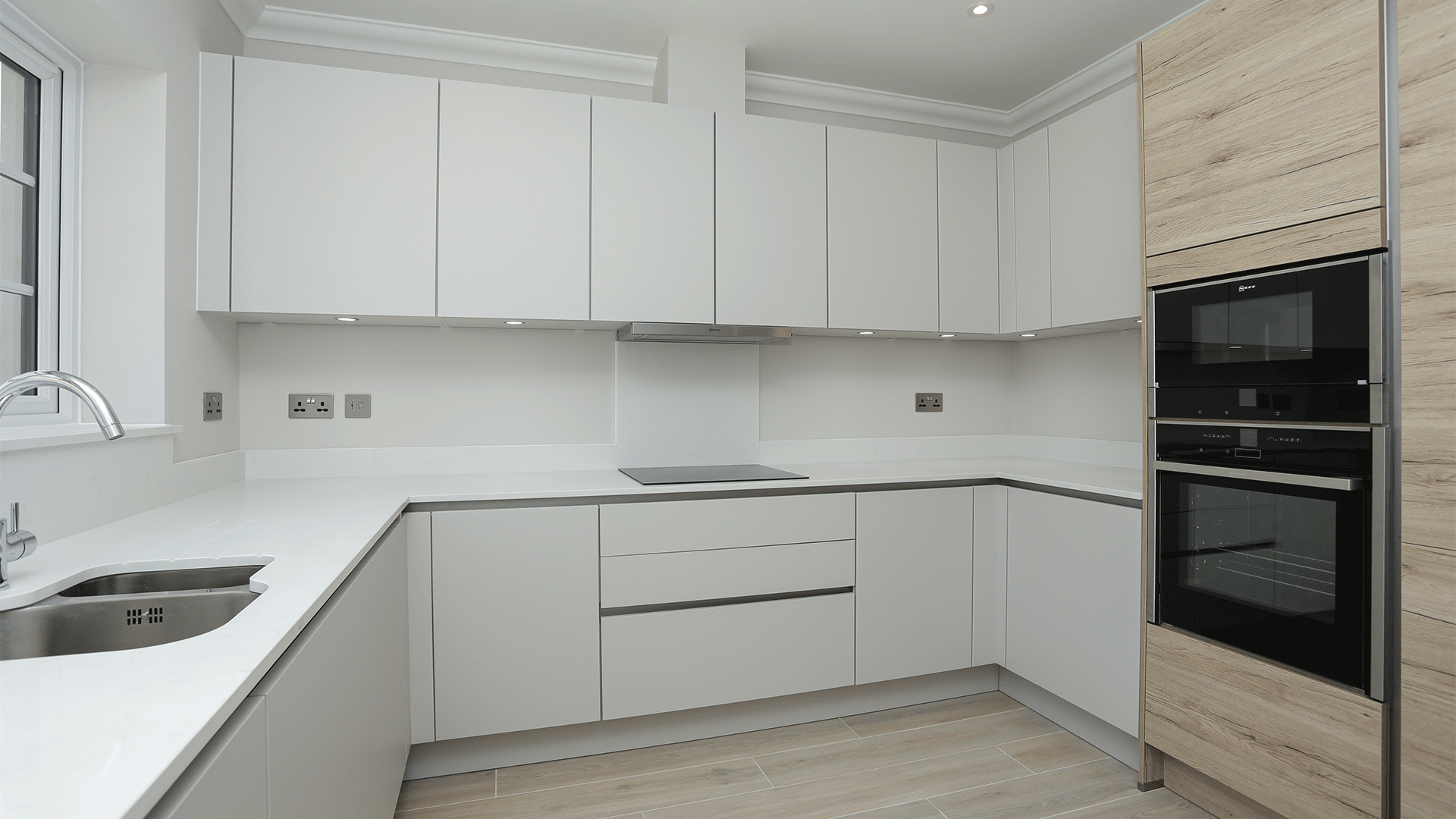 New build bungalow handleless designer kitchen with integrated NEFF appliances at Miller's Meadow plot 10