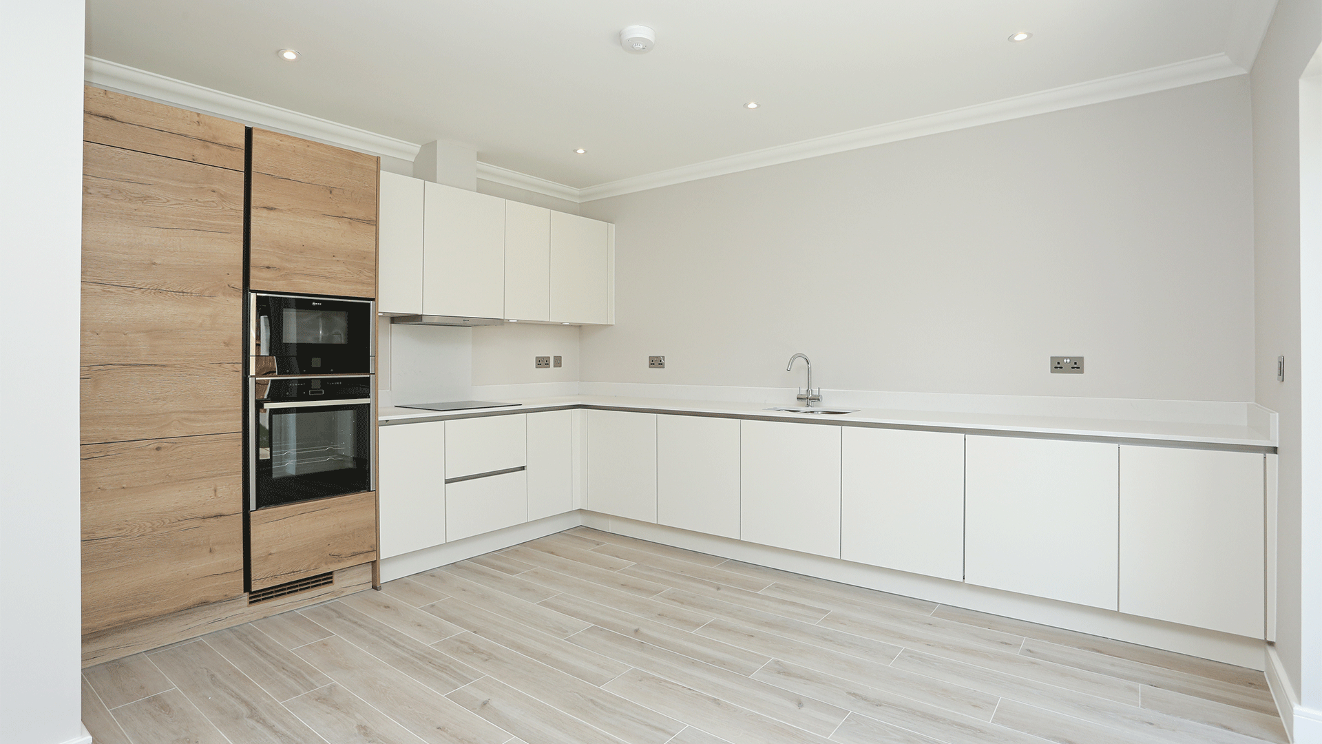 New build bungalow handleless designer kitchen with integrated appliances at Miller's Meadow plot 12