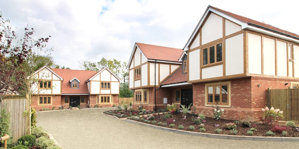 Street view of houses with landscaped lawns at Forest Road