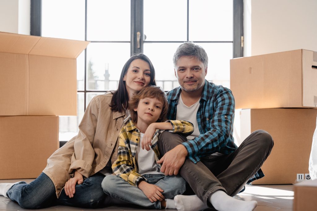 family surrounded by packing boxes