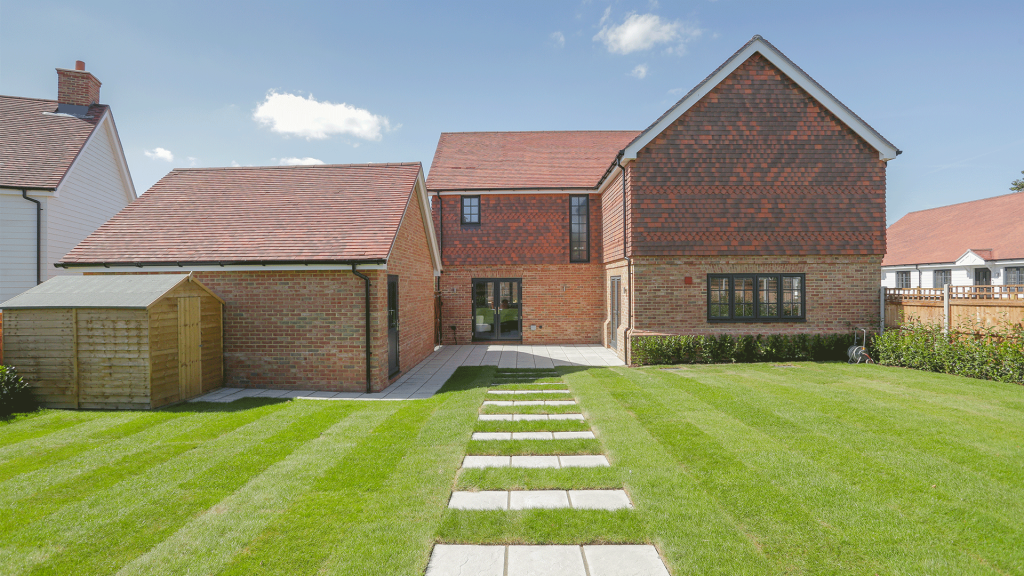 Miller's Meadow - Plot 8 Garden, facing the back of the house with a central path through grass