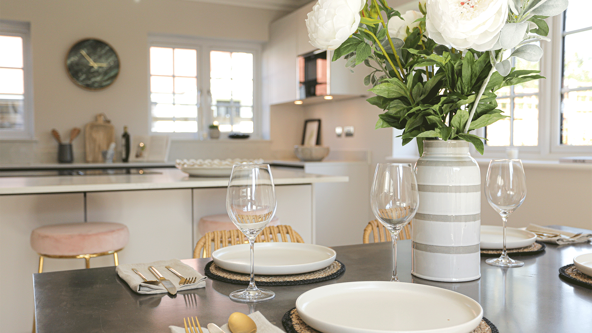 Miller's Meadow Plot 8 close up of the kitchen dining room table with a vase of flowers and a set table